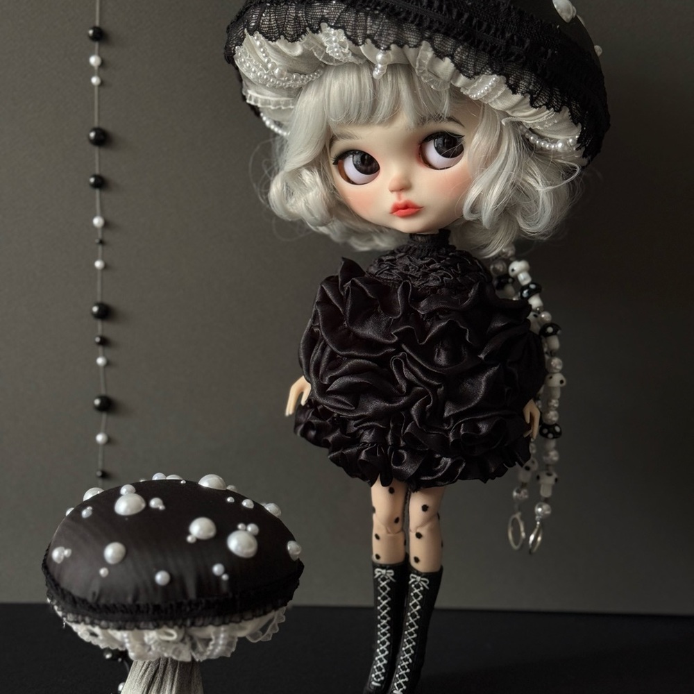 Elegant Black Doll with Pearl Accents